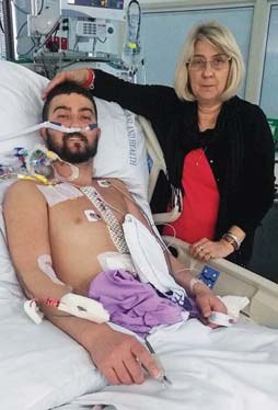 Damien Thompson in hospital with his mum Debbie after his double lung transplant in 2017